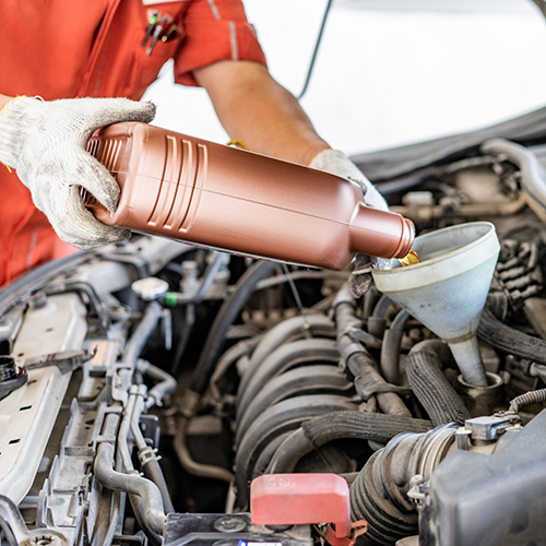 Auto Point Car Care technician performing standard maintenance oil service in Apopka