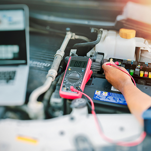 Auto Point Car Care technician diagnosing auto electrical issue in Apopka
